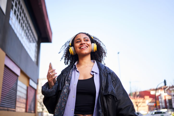 Woman mobile Headphones Happy