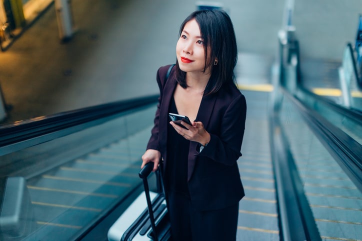 Woman with mobile at the airport